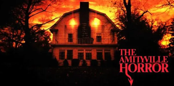 Eerie haunted house with fiery sunset background, perfect for horror fans and Halloween costumes.