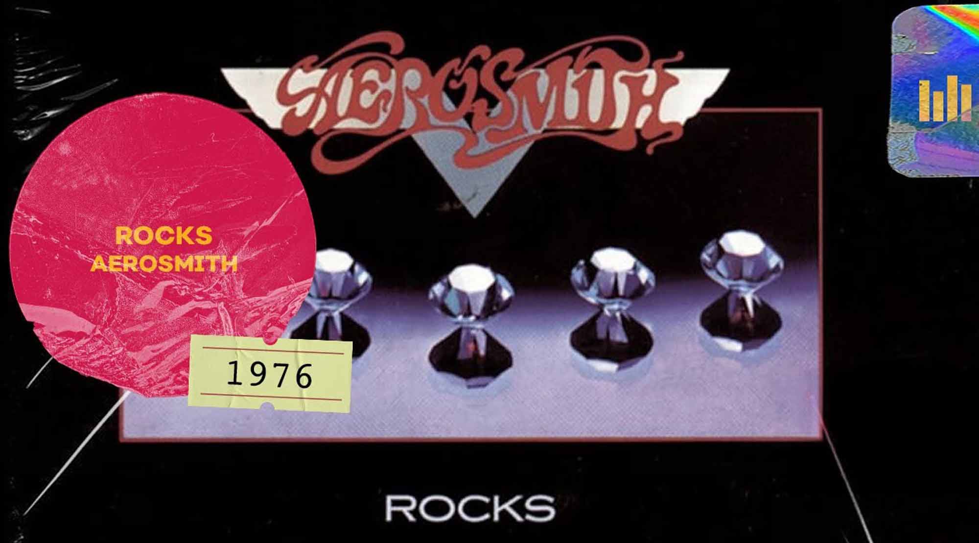 Detailed close-up of Aerosmith's 1976 album "Rocks" vinyl record cover featuring shiny, reflective gemstones and bold vintage text.