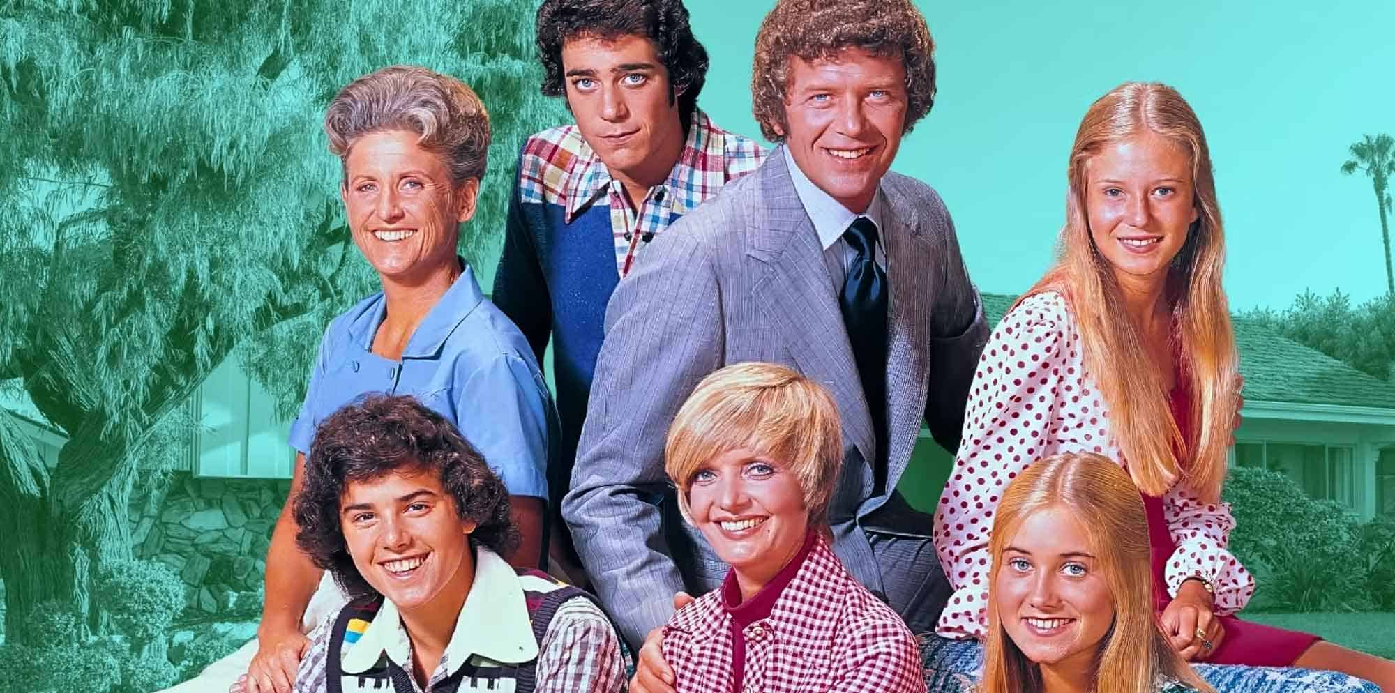 Bright family TV show cast with smiling faces and colorful outfits outdoors.