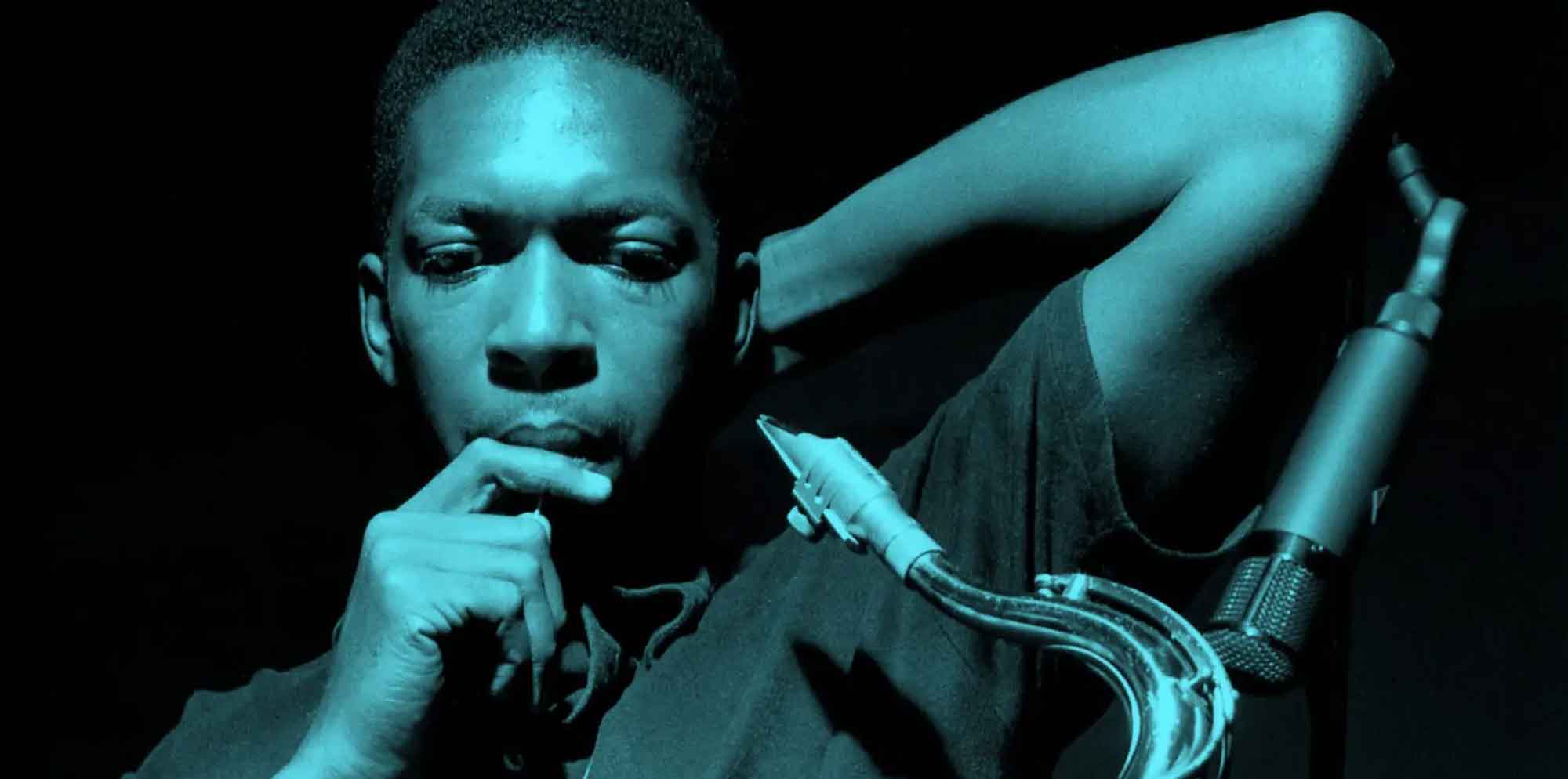 Thoughtful African American man with a prosthetic arm, futuristic style, dark background.
