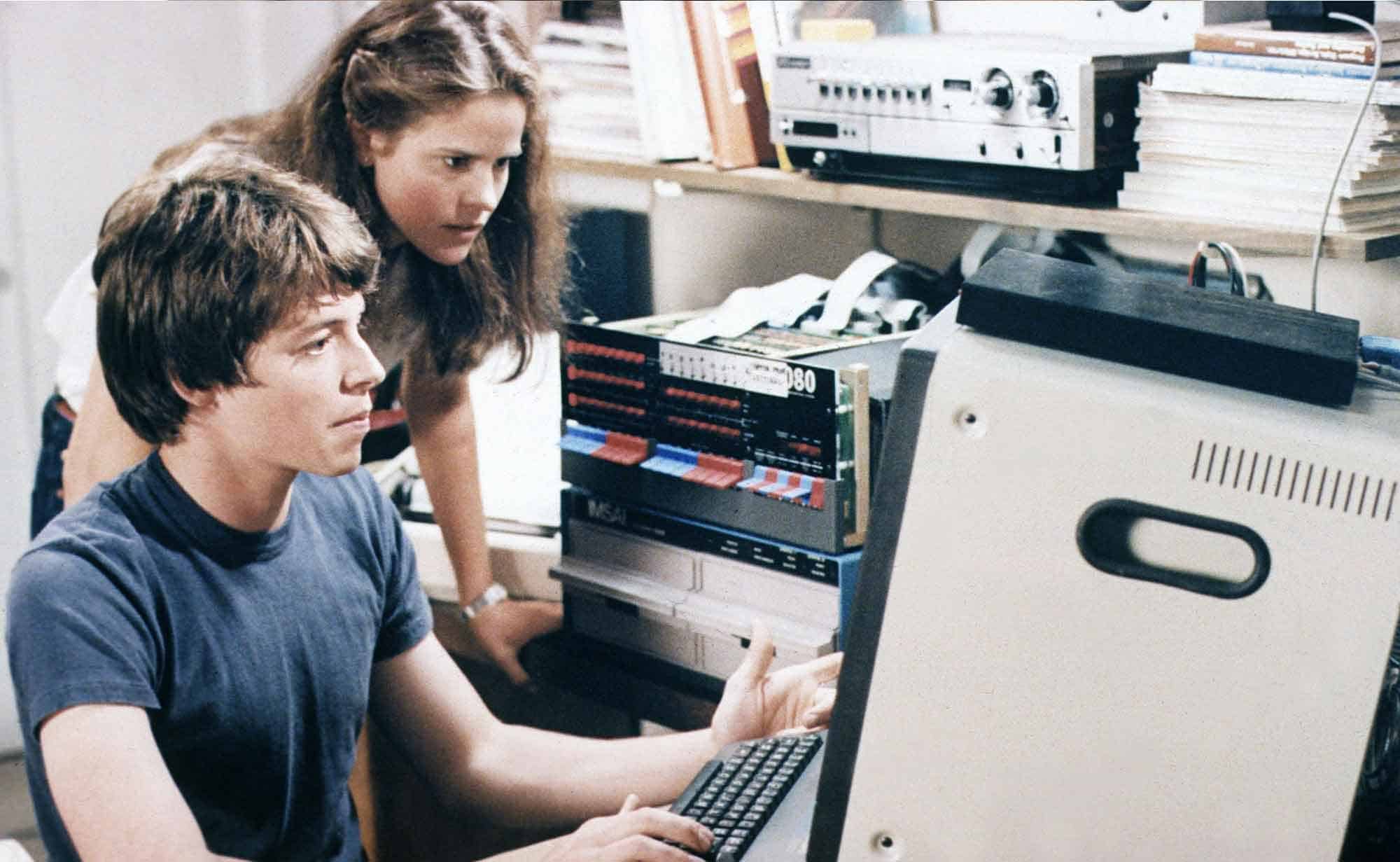 Vintage computer repair, old technology, tech enthusiasts, retro tech, computer repair scene.