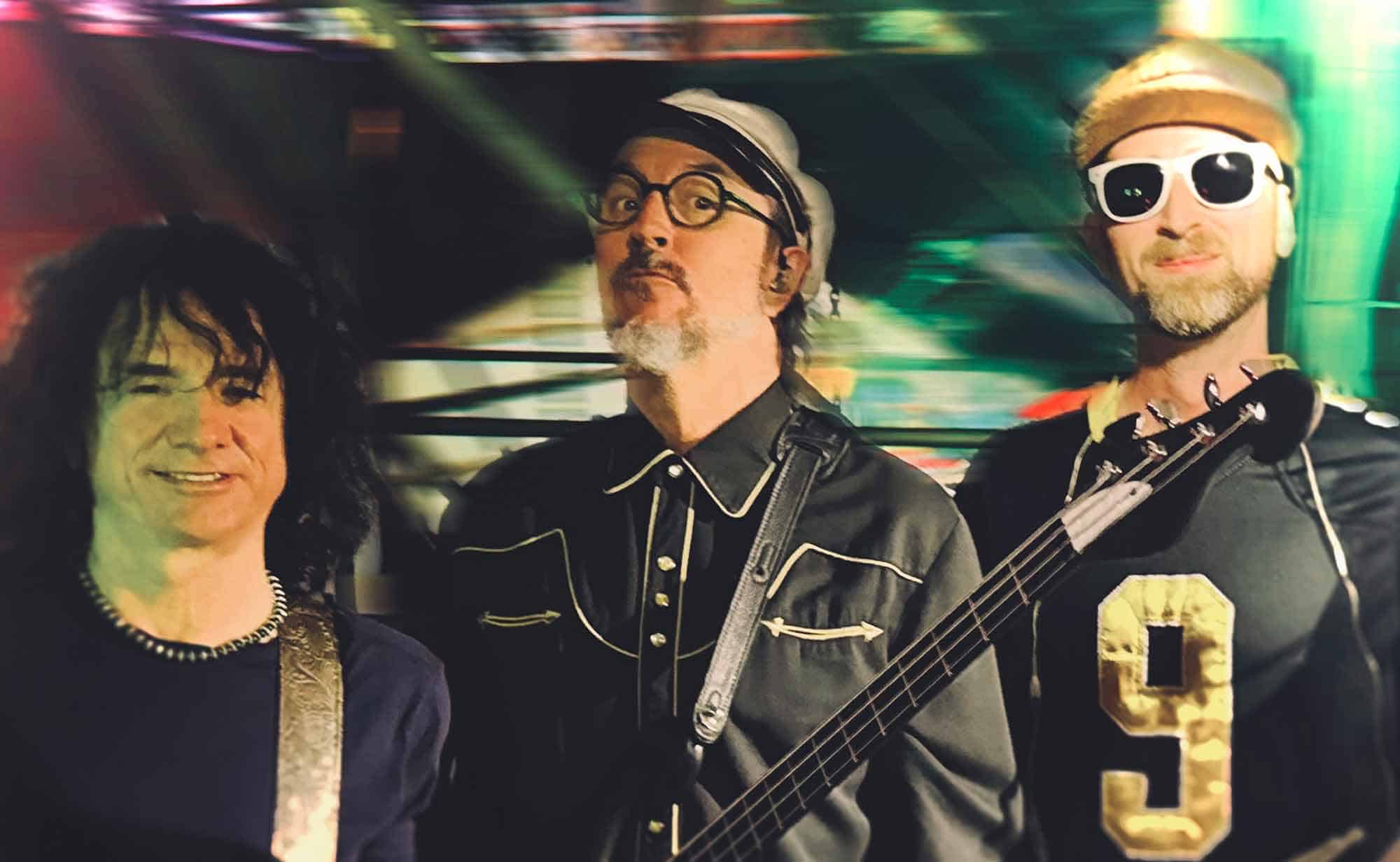High-energy music scene featuring diverse band members with musical instruments, vibrant lighting.