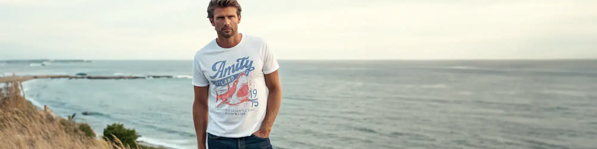 Men's casual fashion t-shirt featuring ocean-themed print, perfect for beach or everyday wear.