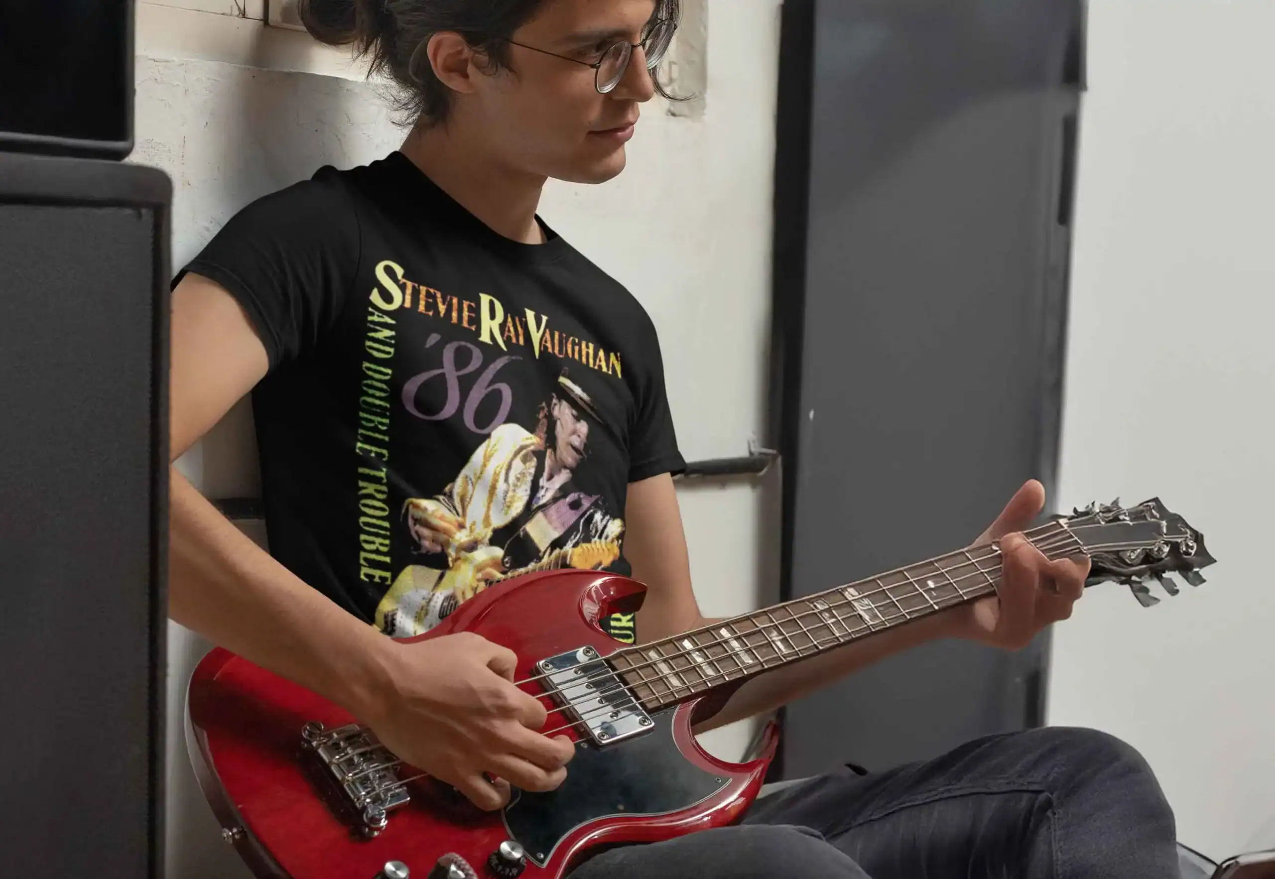 a young man playing a red electric guitar wearing Stevie Ray Vaughan & Double Trouble Live Alive Tour 1986 Men’s T Shirt