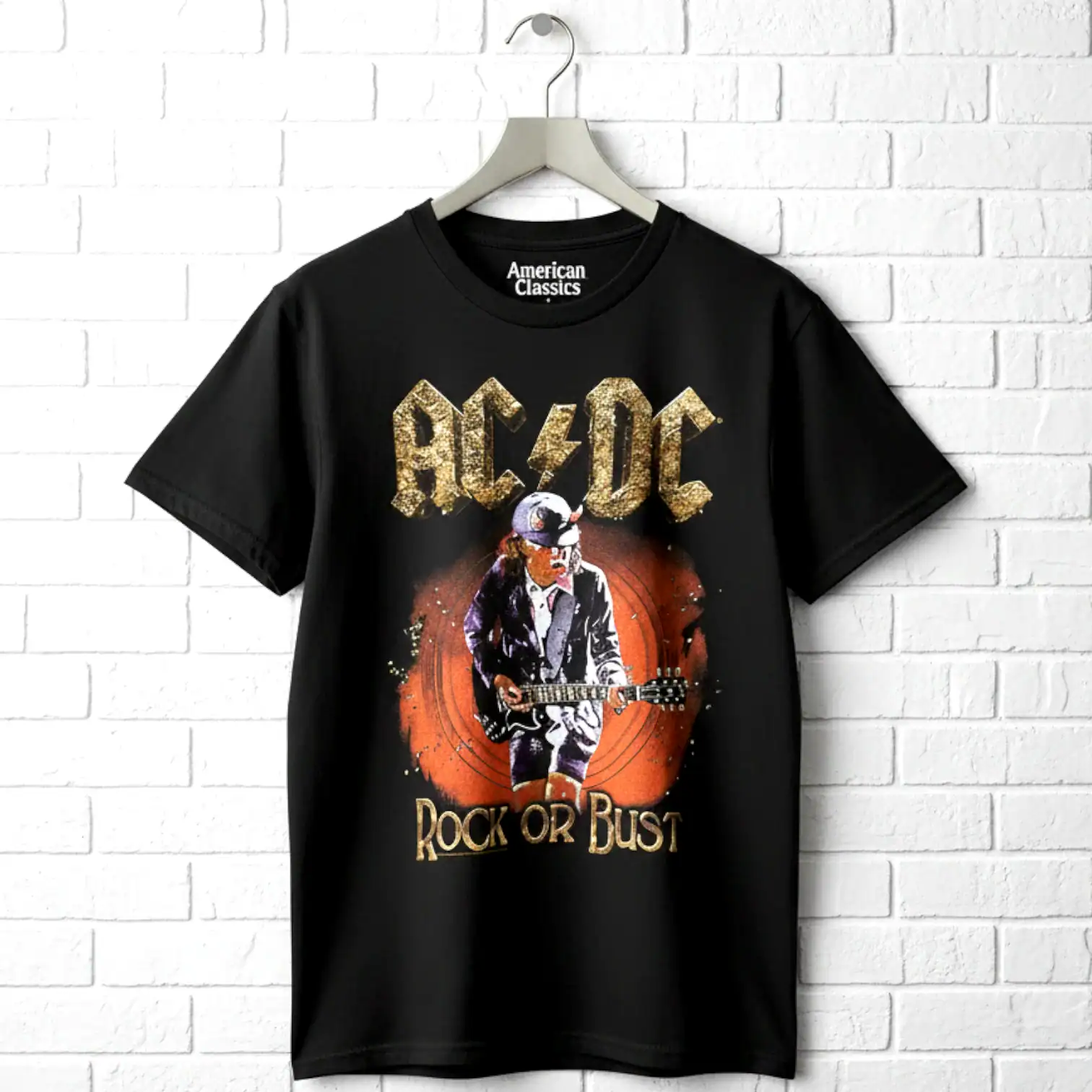 Black AC/DC band t-shirt with a graphic of a child playing guitar, "Rock or Dust" text, on a white b.