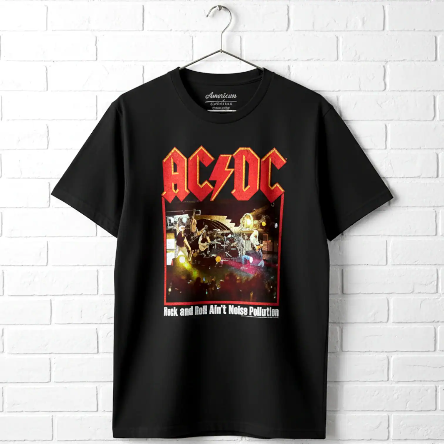 ACDC Noise Pollution concert T-shirt with band logo and stage scene.