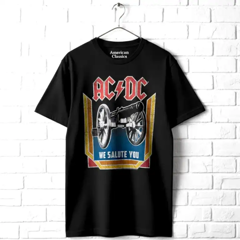 AC/DC cannon graphic T-shirt with "We Salute You" slogan for rock fans.