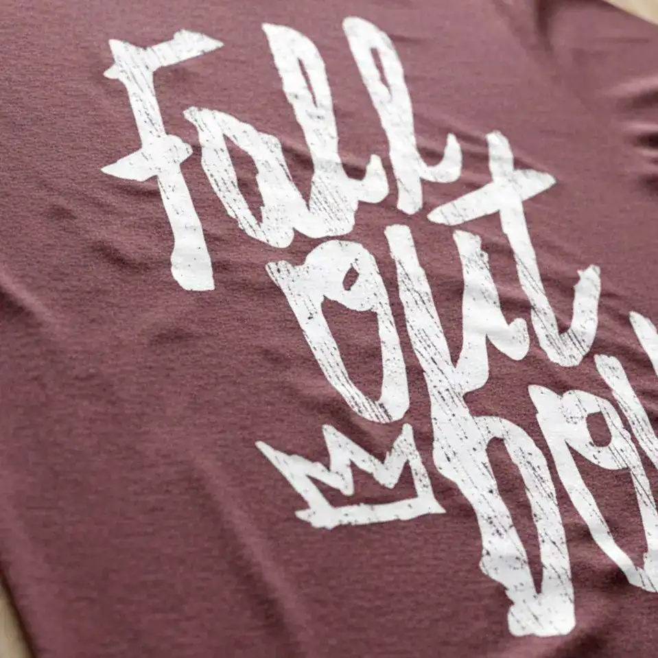 Casual T-shirt with "Folly But My Crown" graphic design.