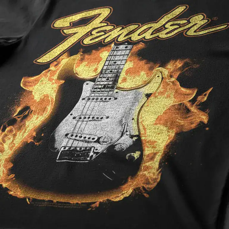 Fender electric guitar surrounded by flames, emphasizing rock music style.