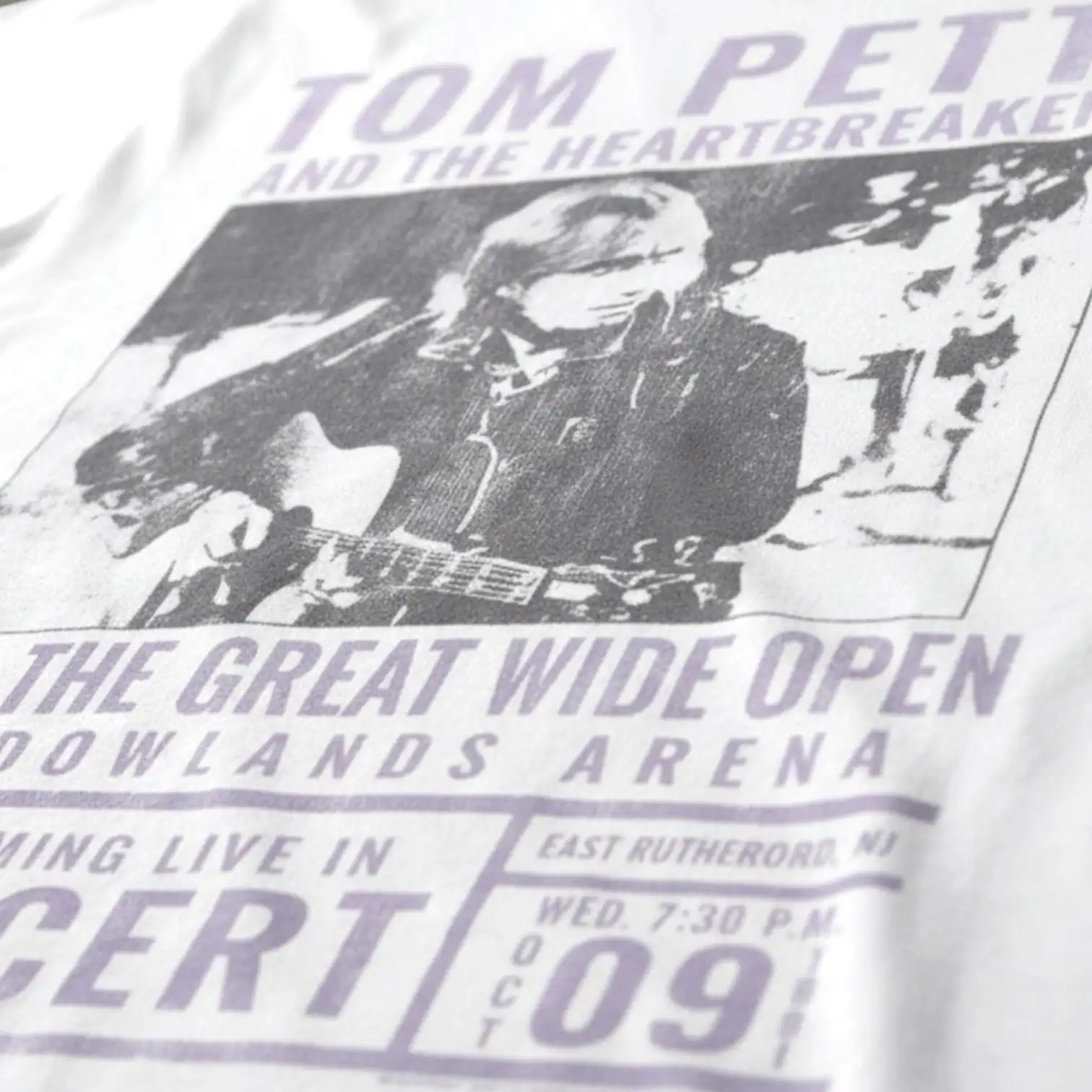 Tom Petty and the Heartbreakers concert poster with guitar image.